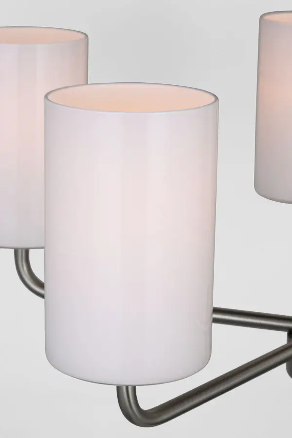 The Rhett Five Light Chandelier brings modern sophistication to any space with its clean-lined design and simple round shape. The brushed nickel finish adds a refined touch that complements contemporary and modern interiors. - alternate view