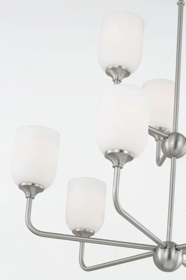 The Emile Extra Large Chandelier delivers dramatic impact with its nine-light configuration and brushed steel finish. Perfect for grand spaces requiring substantial illumination and visual presence. - alternate view
