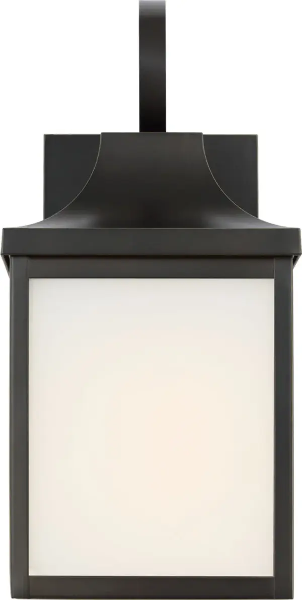 The Saybrook Small Wall Lantern delivers traditional charm in a compact footprint, perfect for flanking doorways or illuminating smaller outdoor spaces. Its antique bronze finish and clear glass panels create welcoming ambiance. - alternate view