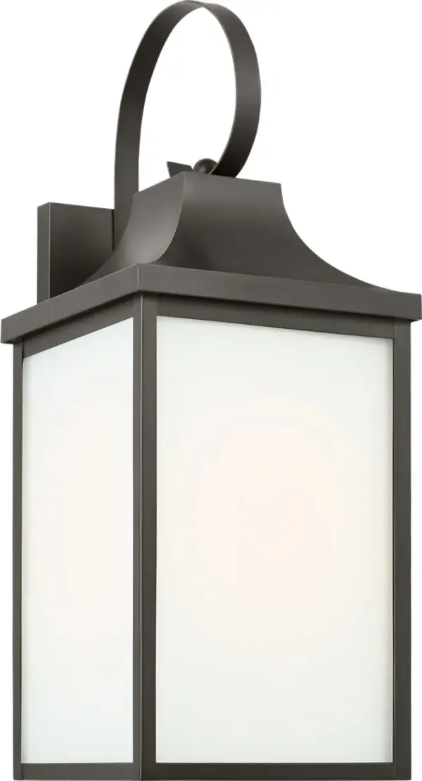 The Saybrook Medium Wall Lantern combines traditional design with durable outdoor construction. Its antique bronze finish and clear glass panels create welcoming illumination for entryways and outdoor living spaces. - alternate view