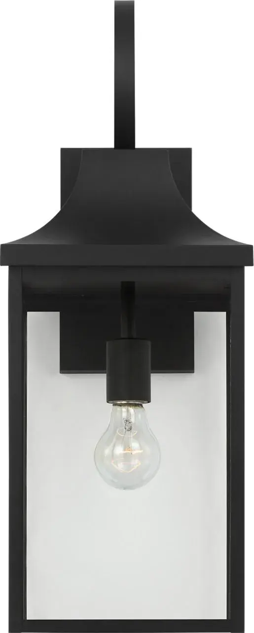 The Saybrook Large Wall Lantern combines traditional design with durable outdoor construction. Its textured black finish and clear glass panels create a welcoming ambiance for entryways and outdoor spaces. - alternate view