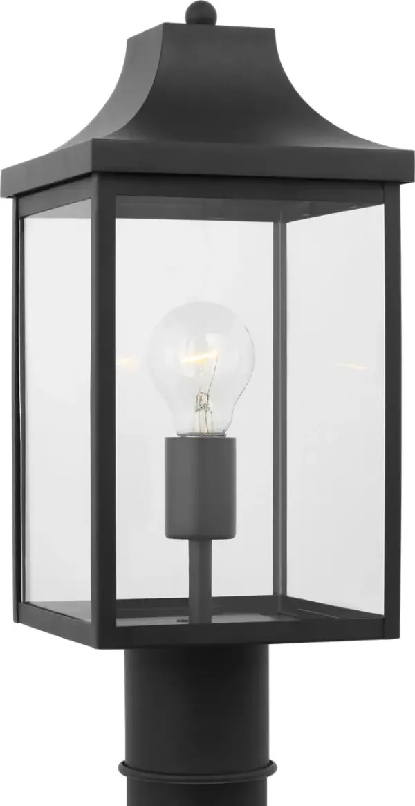 The Saybrook Medium Post Lantern combines traditional design with modern durability. Its textured black finish and clear glass panels create a welcoming ambiance for outdoor spaces while maintaining weather resistance.
