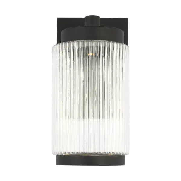 The Ronde Small Wall Lantern combines vertical ribbed glass with a clean metal frame in Textured Black. Wet-rated for durability and available with energy-efficient LED, it's ideal for patios, porches, and entryways.