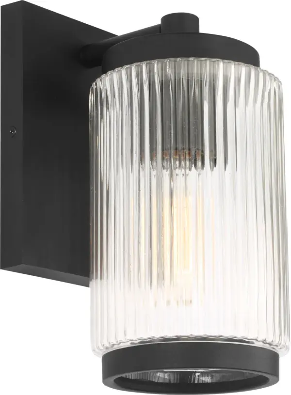 The Ronde Small Wall Lantern combines vertical ribbed glass with a sleek metal frame in Textured Black. Wet-rated for durability and available with Dark Sky accessories, it suits transitional to contemporary exteriors. - alternate view