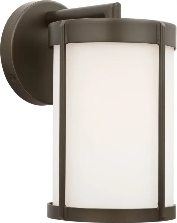The Luning Small Lantern delivers industrial-inspired style in a scaled-down form, perfect for narrow entries and walkways. Its opal etched glass provides soft, targeted illumination while the antique bronze finish adds timeless appeal.