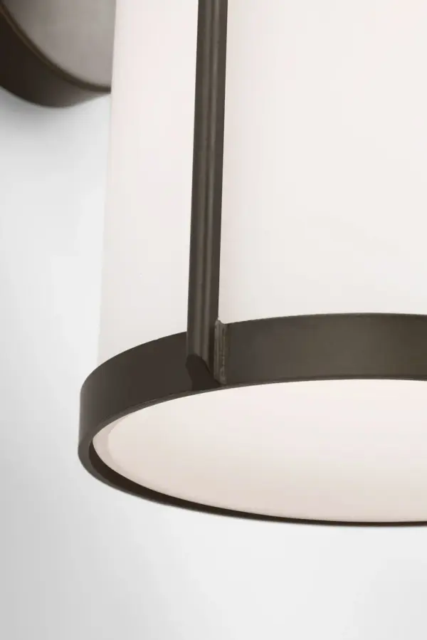 The Luning Small Lantern delivers industrial-inspired style in a scaled-down form, perfect for narrow entries and walkways. Its opal etched glass provides soft, targeted illumination while the antique bronze finish adds timeless appeal. - alternate view