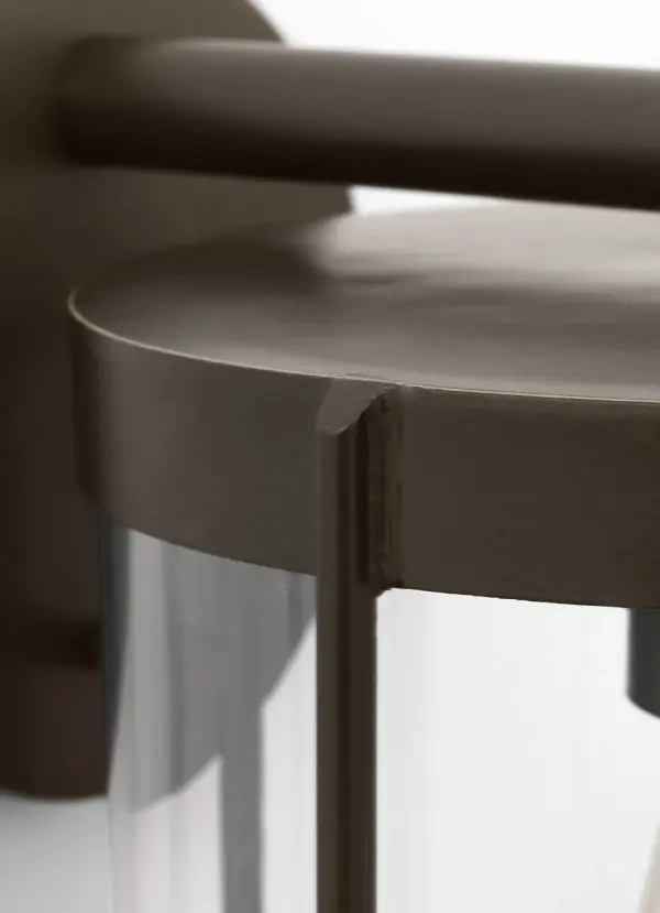 The Luning Medium Lantern combines traditional design with practical outdoor performance. Its cylindrical clear glass diffuser and proportioned metal frame deliver reliable illumination for entryways and pathways. - alternate view