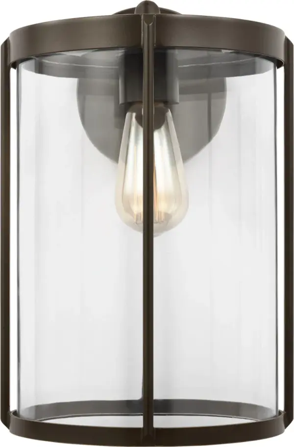 The Luning Large Lantern combines industrial elegance with practical outdoor performance. Its rounded metal frame and cylindrical clear glass shade deliver refined illumination while the wet-rated construction ensures long-lasting durability in any weather condition. - alternate view