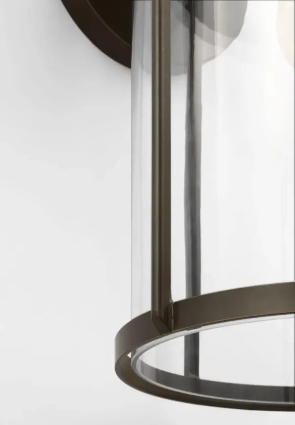 The Luning Large Lantern combines industrial elegance with practical outdoor performance. Its rounded metal frame and cylindrical clear glass shade deliver refined illumination while the wet-rated construction ensures long-lasting durability in any weather condition. - alternate view
