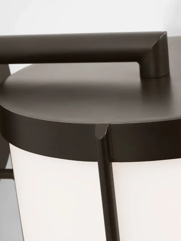 The Luning Extra Large Lantern delivers commanding presence for expansive facades and entryways. Its tall cylindrical shade with opal etched glass provides softened ambient glow, while the rounded metal frame in Antique Bronze finish offers timeless appeal and weather durability. - alternate view
