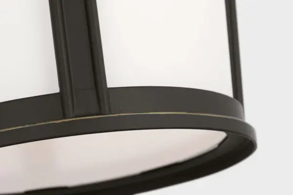 The Portola Medium Lantern balances classic lantern design with contemporary flexibility. Etched white glass creates soft, ambient lighting while the Antique Bronze finish adds warmth and character to any exterior space. - alternate view