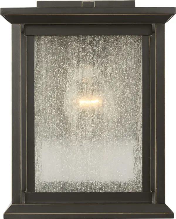 The Audley Small Wall Lantern delivers classic lantern styling in a space-conscious design. Its antique bronze finish and seeded glass create timeless appeal for entries, narrow columns, or secondary walls where full-size fixtures overwhelm. - alternate view