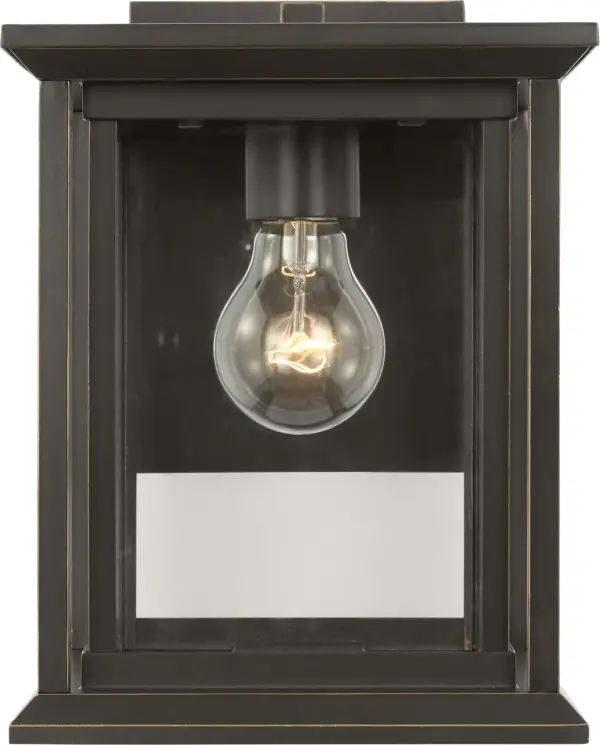 The Audley Small Wall Lantern delivers classic lantern styling in a space-conscious design. Its single-bulb configuration and clear glass panels provide functional illumination while the antique bronze finish adds timeless appeal to entries, columns, and secondary outdoor walls.