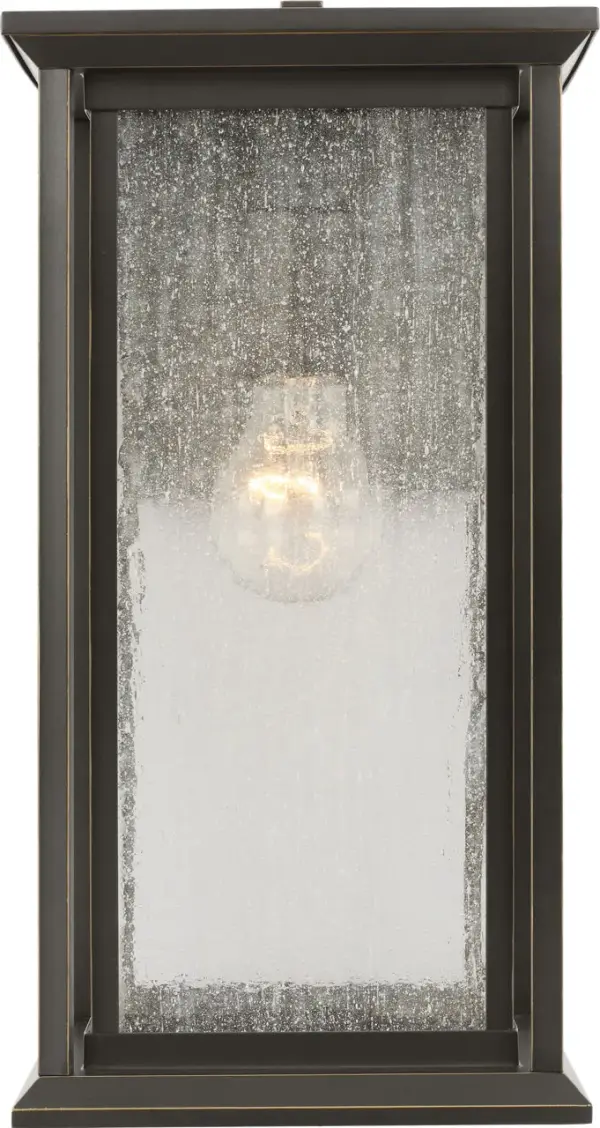 The Audley Medium Lantern combines traditional lantern styling with contemporary clean lines. Featuring distressed seeded glass panels and candle-style lamp sleeves in weather-resistant Antique Bronze finish, it's wet-rated for reliable outdoor performance. - alternate view