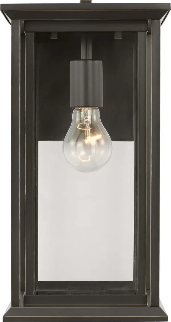 The Audley Medium Lantern combines traditional lantern proportions with contemporary clean lines, featuring clear glass panels and candle-style sleeves. Wet-rated and weather-resistant, it's ideal for outdoor applications.