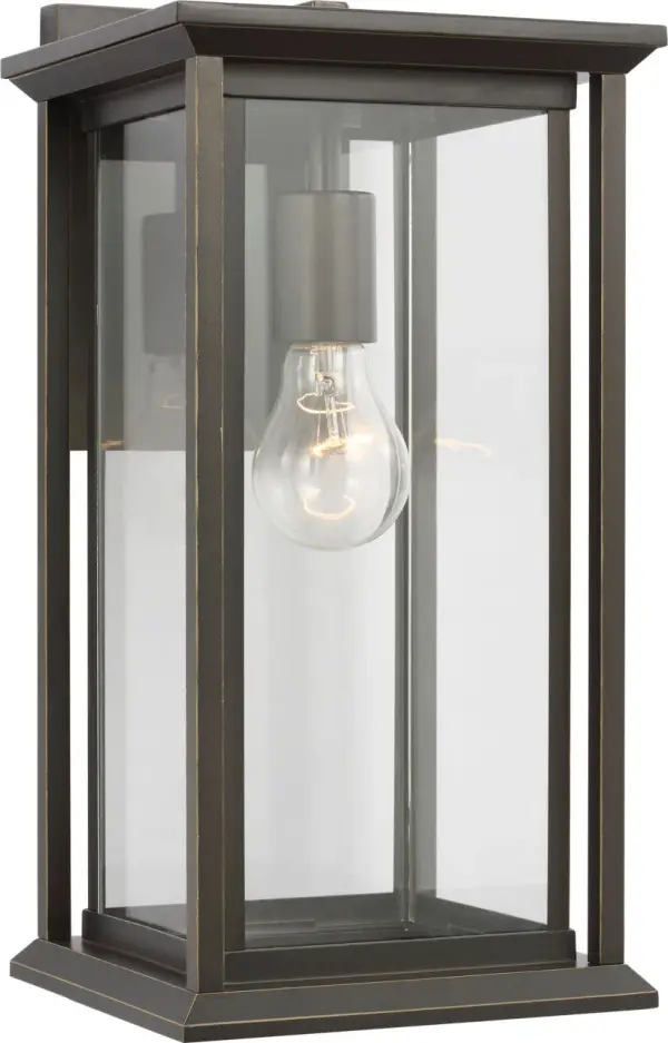 The Audley Medium Lantern combines traditional lantern proportions with contemporary clean lines, featuring clear glass panels and candle-style sleeves. Wet-rated and weather-resistant, it's ideal for outdoor applications. - alternate view
