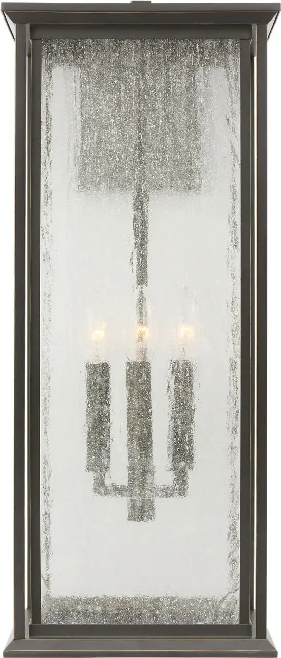 The Audley Extra Large Lantern combines classic lantern proportions with contemporary clean lines, featuring distressed seeded glass and weather-resistant antique bronze finish. Wet-rated for durability and scaled for large facades. - alternate view