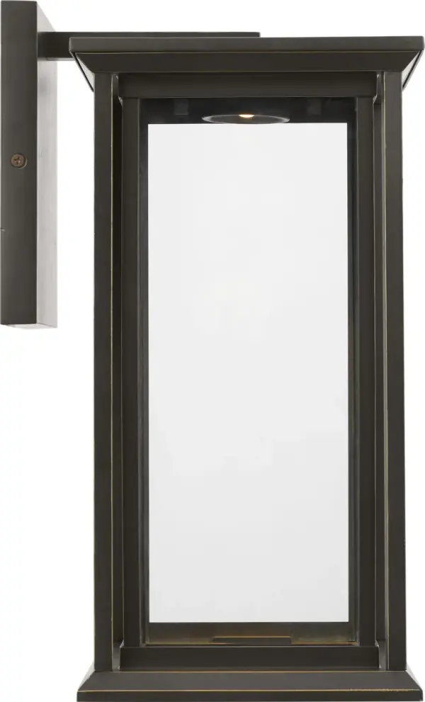 The Audley Medium Lantern blends timeless design with modern LED efficiency. Its weather-resistant Antique Bronze finish and clear glass panels create elegant illumination for entrances and outdoor spaces.