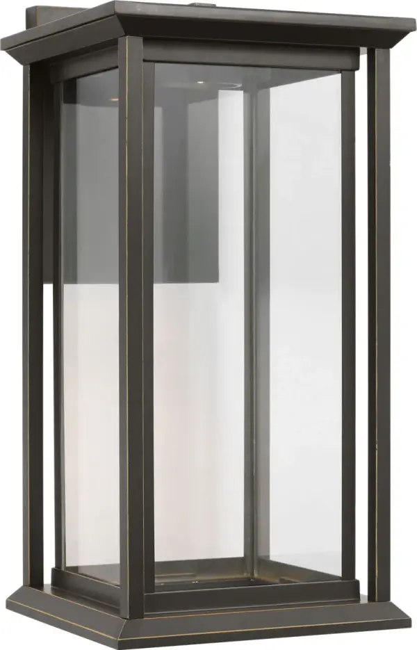The Audley Medium Lantern blends timeless design with modern LED efficiency. Its weather-resistant Antique Bronze finish and clear glass panels create elegant illumination for entrances and outdoor spaces. - alternate view