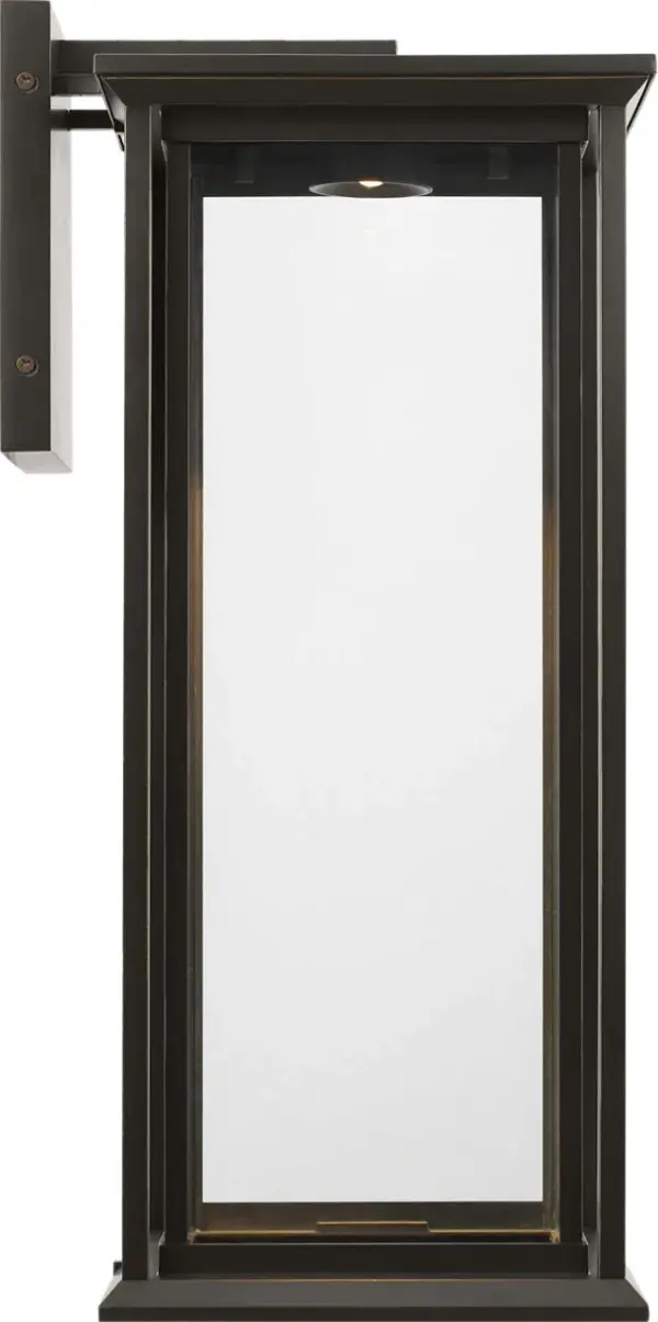 The Audley Large Lantern blends timeless design with modern LED efficiency. Its rectangular metal frame and clear glass panels create elegant illumination for outdoor spaces while maintaining Dark Sky compliance and wet-rated durability. - alternate view