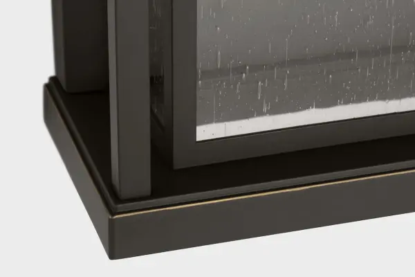 The Faywood Large Lantern offers a perfect balance of contemporary geometry and classic molding details. Its structured metal frame with clear glass panels and integrated LED creates an elegant lighting solution for outdoor spaces. - alternate view