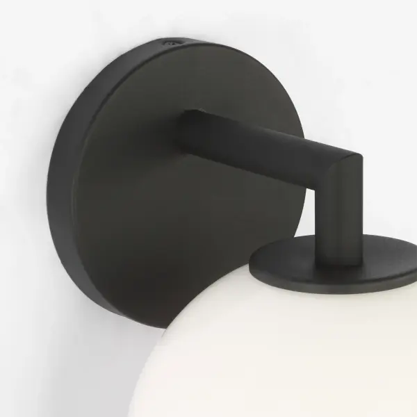 The Toca Small Outdoor Lantern combines clean geometric lines with a softly diffused milk glass shade, creating an understated yet sophisticated lighting solution for exterior spaces. - alternate view