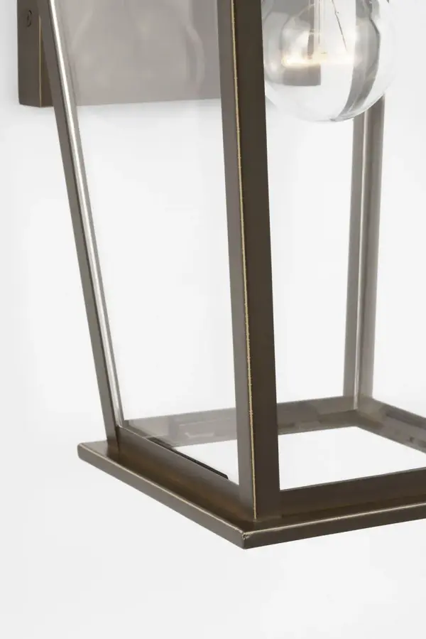 The Linton Medium Lantern delivers understated sophistication with its tapered frame and clear glass enclosure. Perfect for entrances and outdoor sitting areas, it balances traditional design with versatile styling. - alternate view