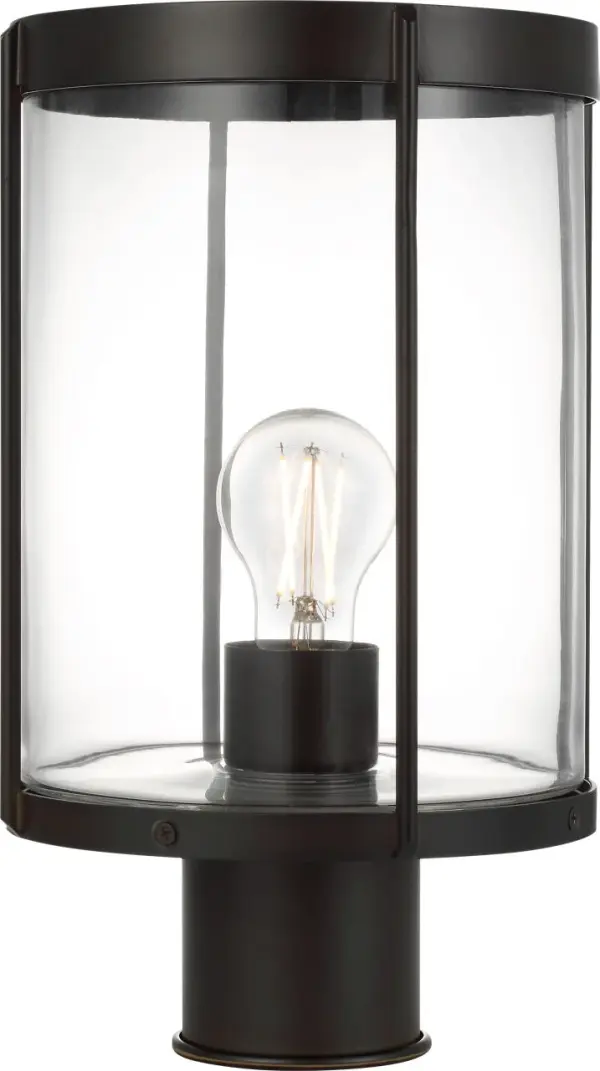 The Luning post lantern combines industrial elegance with practical outdoor performance. Its rounded metal frame and cylindrical clear glass shade deliver a subtle, welcoming glow while the textured black finish and wet-rated construction ensure long-lasting durability in any weather condition.