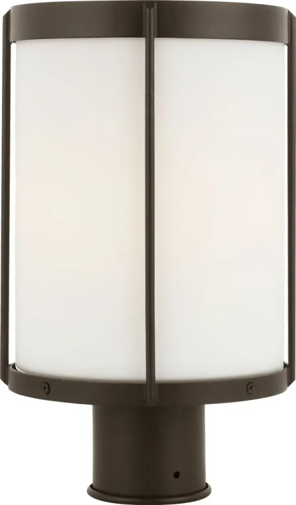 The Luning post lantern combines industrial design with transitional elegance, featuring a rounded metal frame in Antique Bronze and etched white glass for a soft, welcoming glow. Wet-rated for durability and versatile styling.