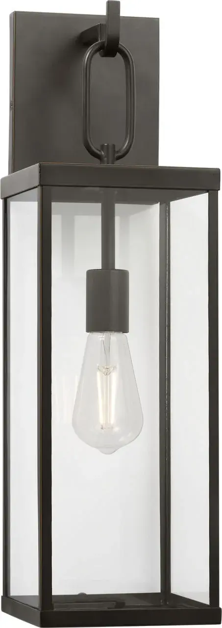 The Rox Medium Lantern combines modern geometry with classic outdoor appeal. Its bold rectangular frame and clear glass panels create an inviting glow while the Antique Bronze finish adds warmth to any exterior.