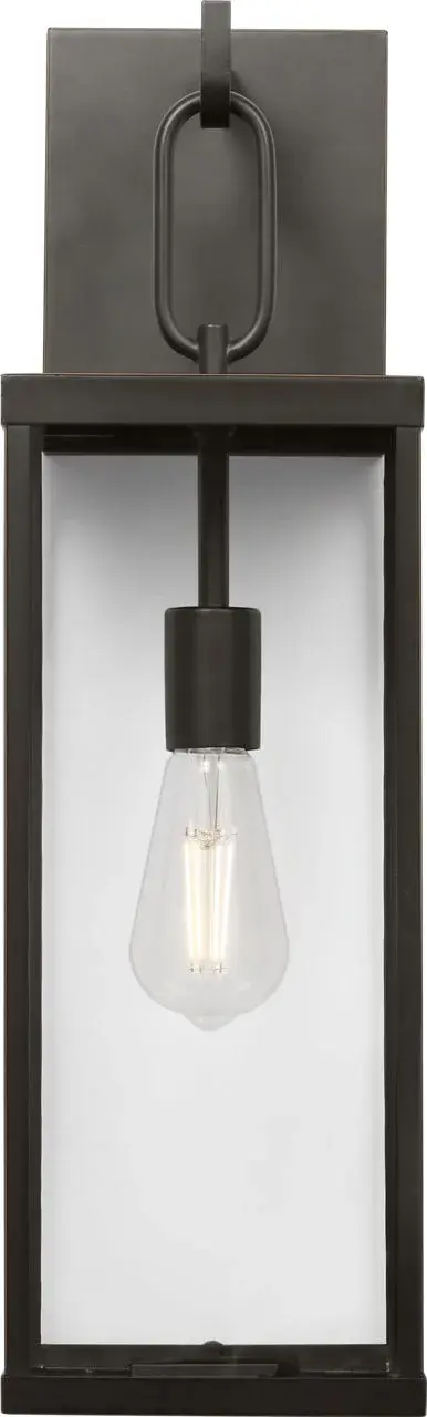 The Rox Medium Lantern combines modern geometry with classic outdoor appeal. Its bold rectangular frame and clear glass panels create an inviting glow while the Antique Bronze finish adds warmth to any exterior. - alternate view