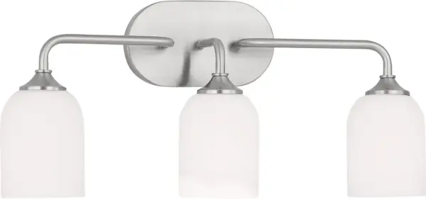The Emile Large Vanity combines transitional styling with practical three-light illumination. Its brushed steel finish and glass globes provide excellent task lighting while adding sophisticated style to bathrooms. - alternate view