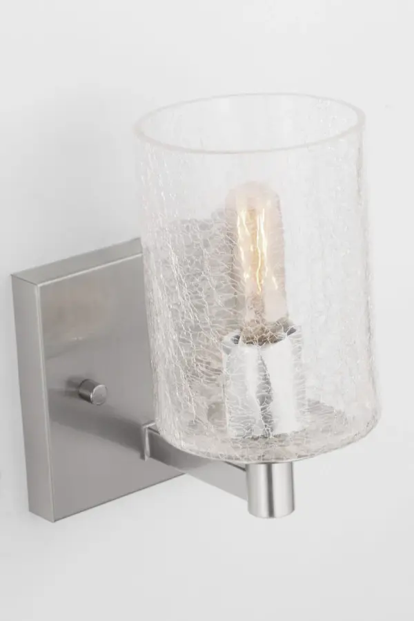 The Parker wall sconce combines clean lines with a classic brushed steel finish, making it ideal for modern bathrooms and transitional spaces. Its compact single-light design provides focused illumination.