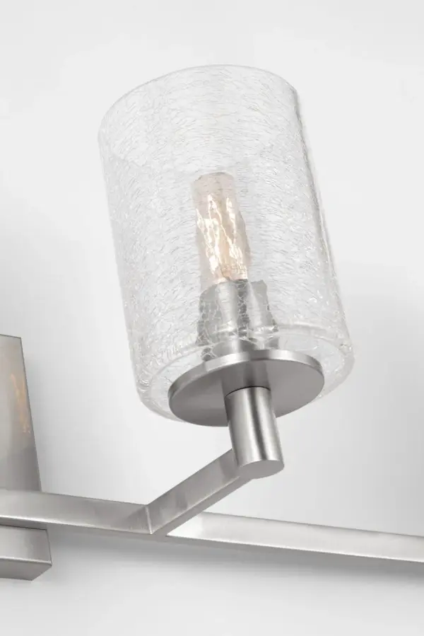 The Parker bath vanity combines transitional styling with practical four-light illumination. Its brushed steel finish and glass globes provide even, flattering light ideal for grooming tasks while complementing modern bathroom aesthetics.