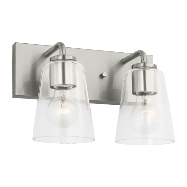 The Miles Medium Vanity combines refined traditional design with contemporary versatility. Its tapered clear glass shades and brushed nickel finish create a sophisticated look that adapts seamlessly to classic, transitional, or modern bathrooms. - alternate view
