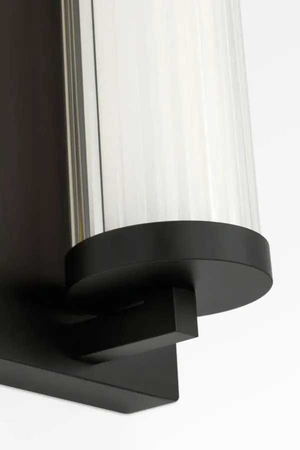 The Weston 22" LED Vanity delivers efficient, glare-free illumination through its ribbed glass lens and integrated LED technology. Its linear design and midnight black finish bring contemporary sophistication to bathrooms. - alternate view