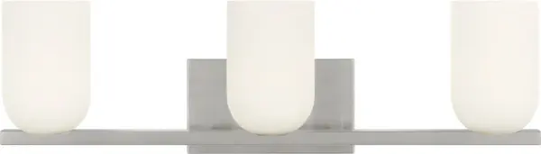 The Neblina vanity fixture combines quiet geometric design with frosted glass domes for diffused, flattering light. Perfect for primary baths and powder rooms, its brushed nickel finish and transitional style complement various décor.