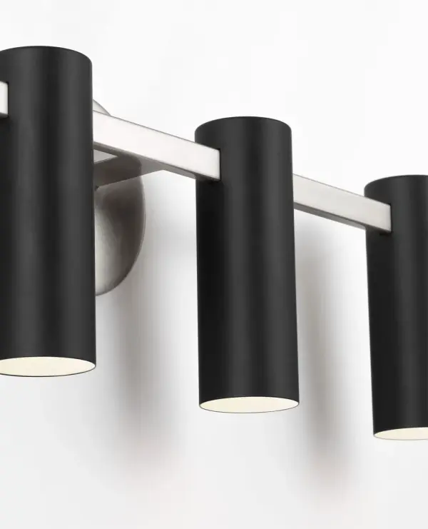 The Zentro vanity light delivers balanced illumination with four evenly spaced cylindrical shades. Its brushed nickel finish and modern design work well in both residential and commercial bathrooms. - alternate view