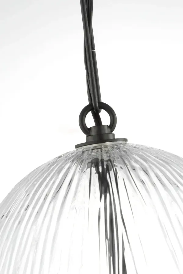 The Serafina 11" Pendant merges organic inspiration with modern craftsmanship. Its combed glass shade echoes handmade ceramics, casting soft ambient light perfect for intimate spaces. The aged iron finish adds warmth and character. - alternate view