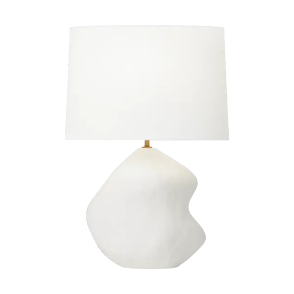 The Broxton Medium Table Lamp by Hable combines organic ceramic artistry with refined brass accents and a crisp linen shade. Its fluid, curving form creates a striking focal point while delivering soft, ambient lighting.