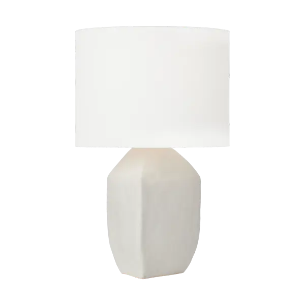 The Sybert Medium Table Lamp combines handcrafted artistry with contemporary design. Its distinctive angular ceramic base and white linen drum shade create a refined focal point that elevates any interior with soft, welcoming illumination.