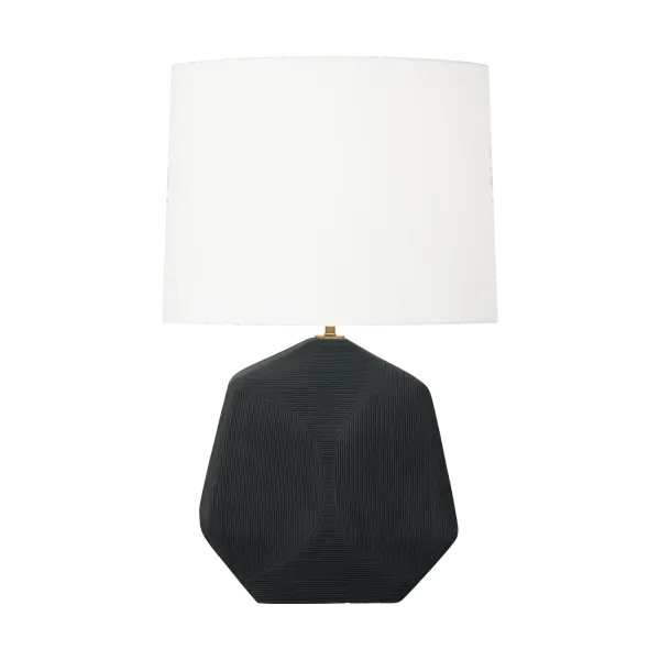 The Tallulah Medium Table Lamp features a striking sculptural ceramic body with delicate geometric etching that adds artisanal character. The rough black ceramic finish paired with a white linen drum shade creates sophisticated contrast while diffusing warm, ambient light.