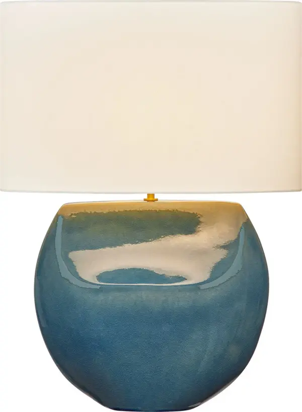 The Pente 27" Table Lamp combines bold sculptural form with hand-crafted ceramic artistry. Its rounded dual-facade design catches light beautifully while the Deep Ocean Crackle finish adds organic texture. The natural linen shade creates warm, diffused illumination perfect for intimate spaces.
