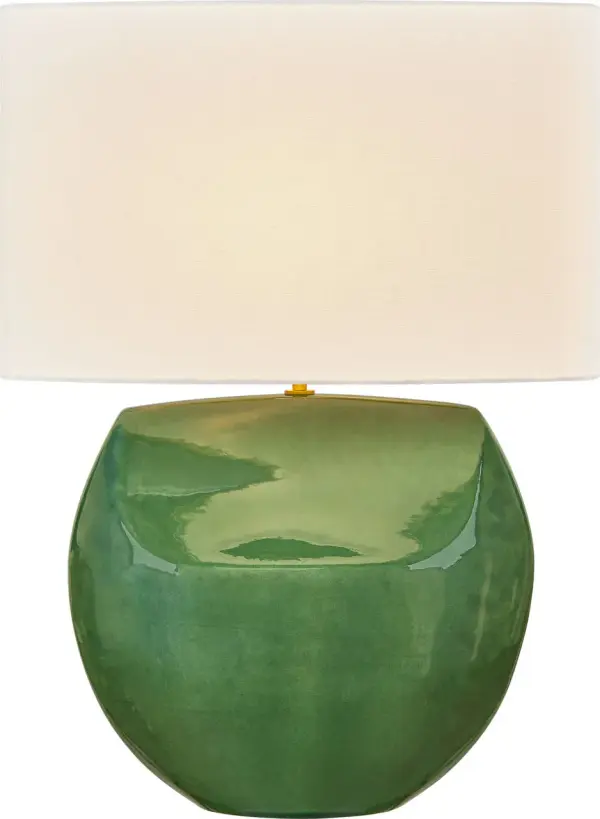 The Pente 27" Table Lamp combines hand-shaped ceramic artistry with natural linen softness, creating a sophisticated focal point. Its rounded dual-facade form catches light beautifully while maintaining quiet luxury through expressive materiality.