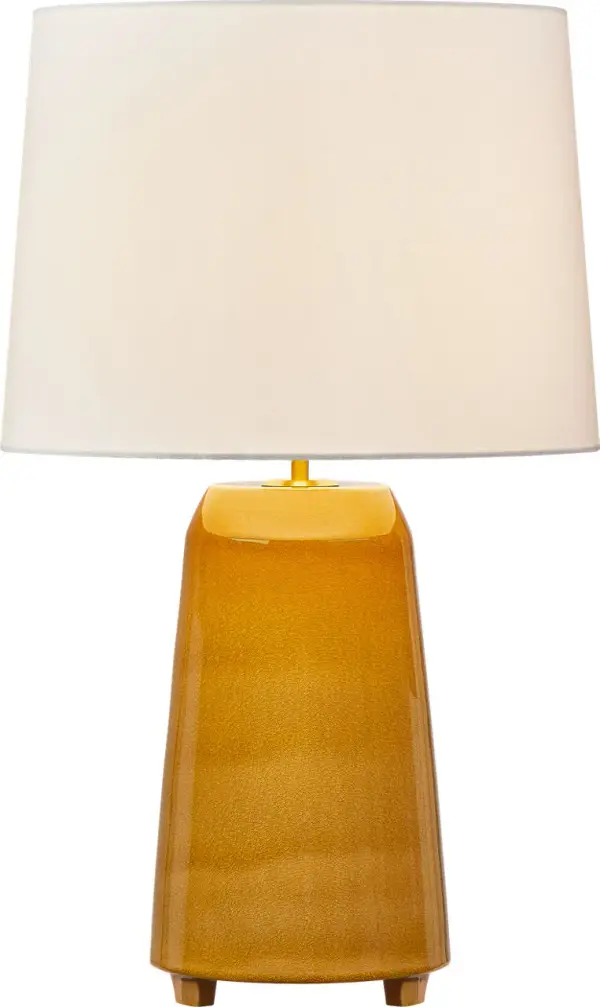 The Nell 28" Table Lamp transforms ancient Siwa sand house architecture into a modern sculptural form. Its hand-built ceramic construction with a flared footed base offers quiet luxury and artistic presence for sophisticated interiors.