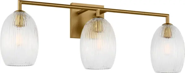 The Serafina 27" Bath Vanity Light brings organic sophistication to any space with its combed glass shades inspired by dried ceramics and botanical forms. The burnished brass finish adds warmth while the textured glass diffuses soft, ambient light.