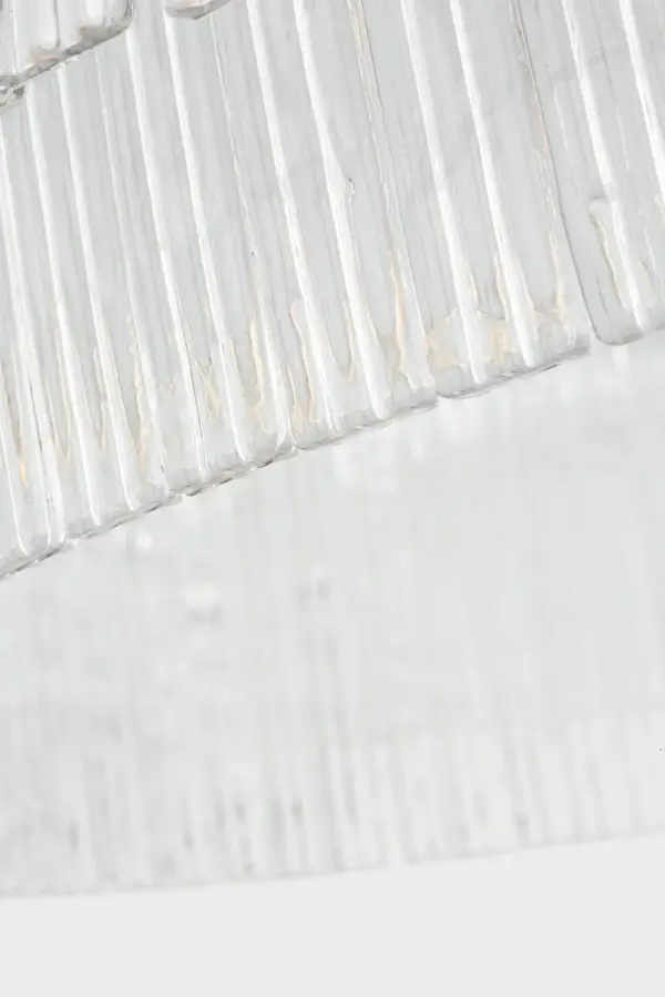 The Maderno 48" chandelier makes a bold statement with its substantial scale and hand-rubbed antique brass finish. Clear glass shades provide brilliant illumination while the linear design suits both traditional and contemporary spaces. - alternate view