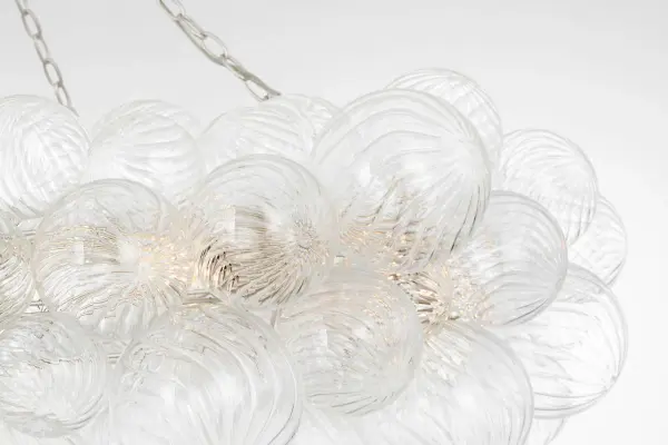 The Talia 54" Ring Chandelier by Julie Neill combines whimsical artisanal glass orbs with refined metalwork for a statement piece that adds feminine elegance and sparkling light to grand spaces. - alternate view