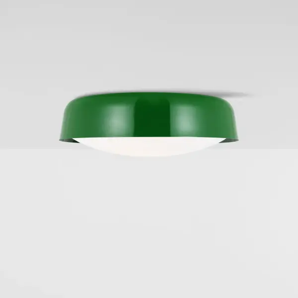 The Draper flush mount brings designer sophistication to compact spaces with its distinctive green metal shade and milk glass diffuser. The dual-direction lighting creates ambient illumination while the kate spade new york design adds a refined, modern aesthetic. - alternate view