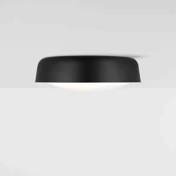 The Draper flush mount combines modern elegance with practical functionality. Its sleek midnight black finish and milk glass diffuser create ambient lighting that illuminates both upward and downward, perfect for low-ceiling spaces. - alternate view